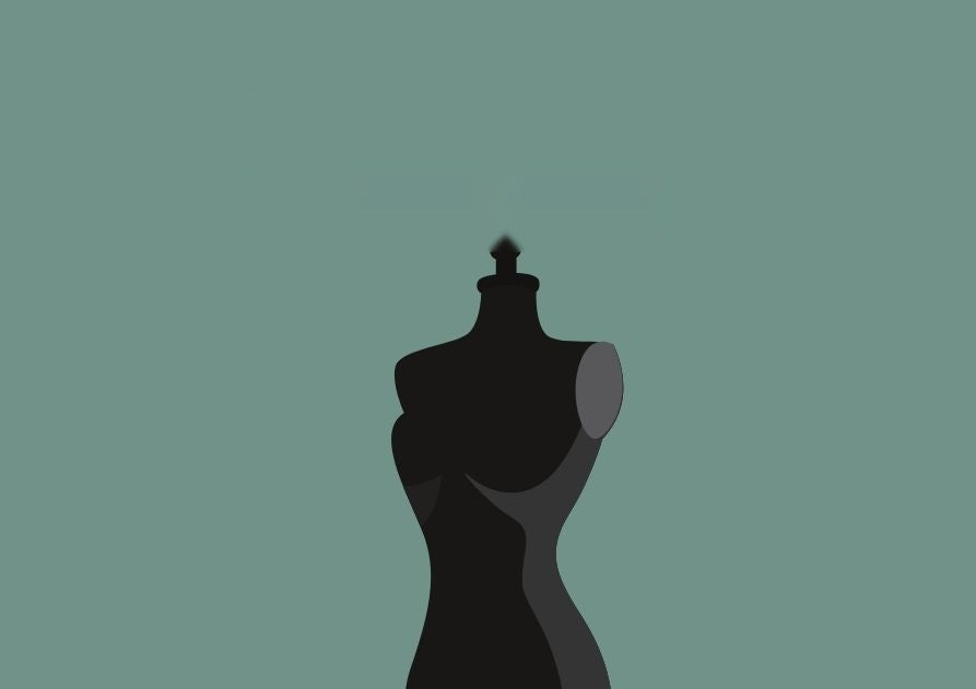 La silueta de un maniquí de costura sobre fondo verde grisáceo